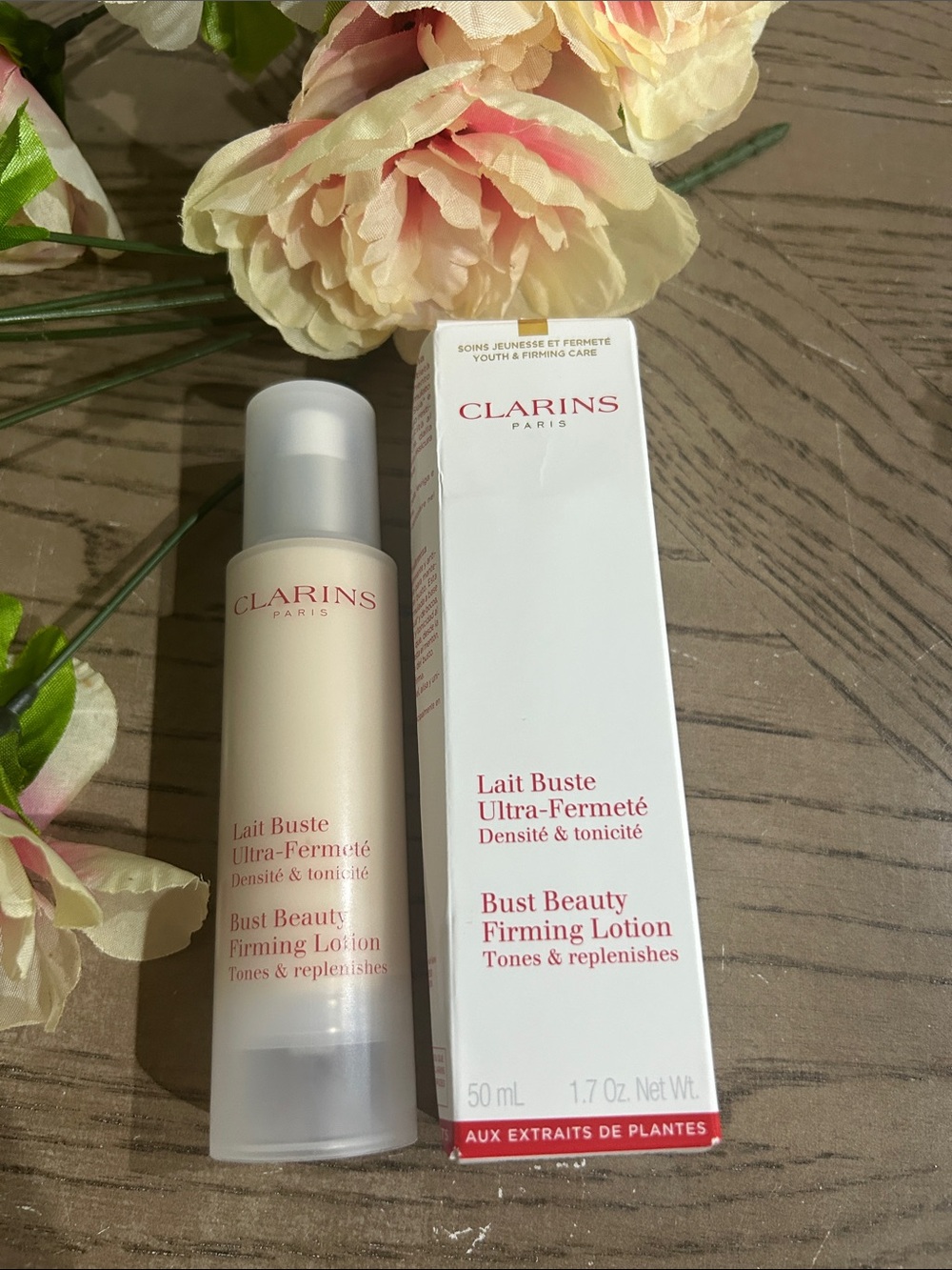 Clarins Bust Beauty Firming Lotion - Cream & White with Red Logo